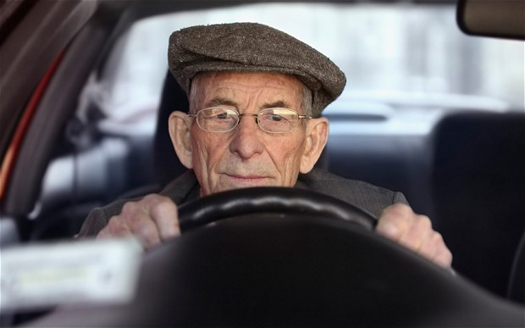 Portrait of a senior man driving a car