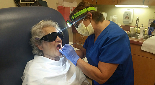 Dentist working on senior