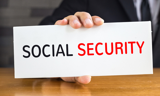 Social security, message on white card and hold by  businessman