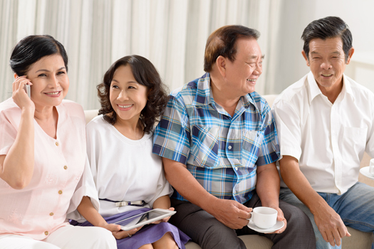 Senior friends socializing at home