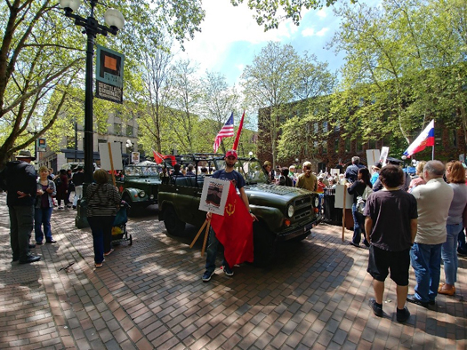 Photo of parade with Russian-speaking World War II veterans and their families on Victory Day, celebrating the anniversary of the surrender of Nazi Germany to Allied forces.