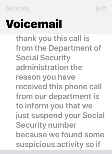 this image of a voicemail transcription regarding a suspended Social Security number is a scam