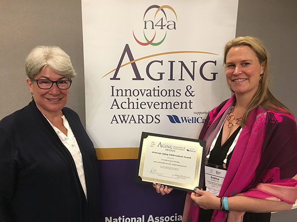 DS communications manager Irene Stewart and planning manager Andrea Yip accepted the N4A 2019 Aging Achievement Award on behalf of Age Friendly Seattle on July 28 in New Orleans.