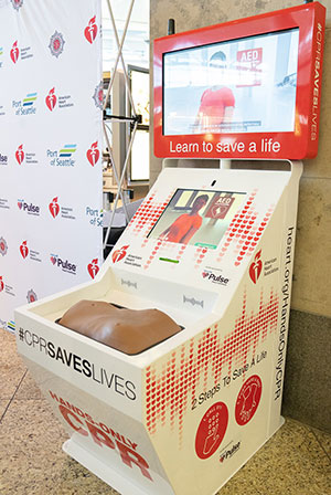 The Hands-Only CPR kiosk at Sea-Tac Airport features video and a rubber torso for practice and testing.