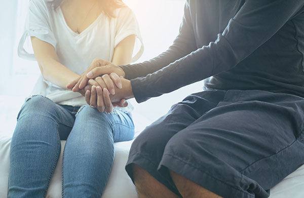 two people holding hands