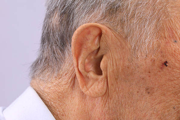 close-up of an elderly man's ear