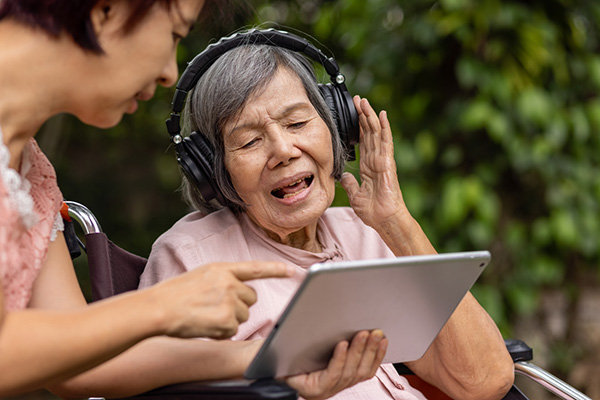 caregiver doing music therapy with patient