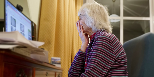 senior woman looking at her computer