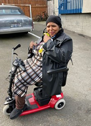 Linda riding her new scooter.