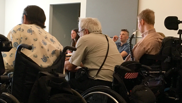 Many people are gathered to participate in a disability commission in 2017.