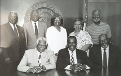 a black and white photo of Mayor Norman B. Rice and original members of the Mayor’s Council on African American Elders