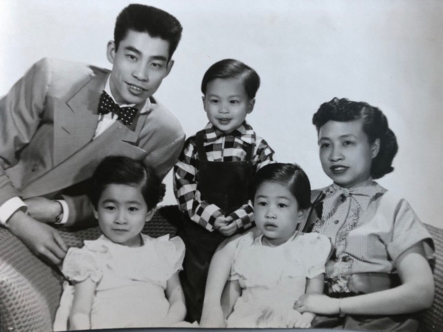 Black and white Yuen Lui Family Portrait circa 1952. Back (l-r): David Lau, Eddie Lau. Seated (l-r): Betty, Linda, May Lau