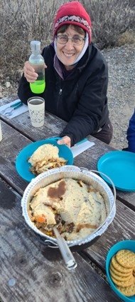 Contributor Katy Wilken shown with the shepherd's pie she and her husband cook on the road.