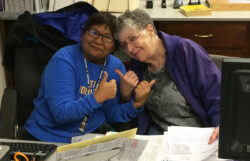 Free Tax Prep volunteer Roxanne with a happy client.