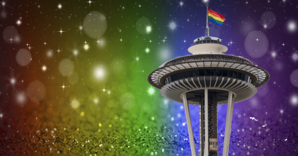 Seattle, USA - June 29, 2014: The famous Seattle Space Needle flying the rainbow flag mid day during the Seattle Pride Parade.