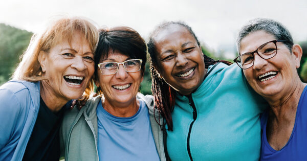 Happy senior sports people having fun after exercising outdoors at Park City - Fitness joyful Elderly lifestyle