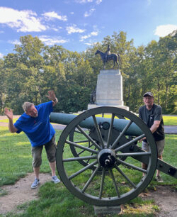 The author's husband and brother-in-law in front of a Gettysburg exhibit.