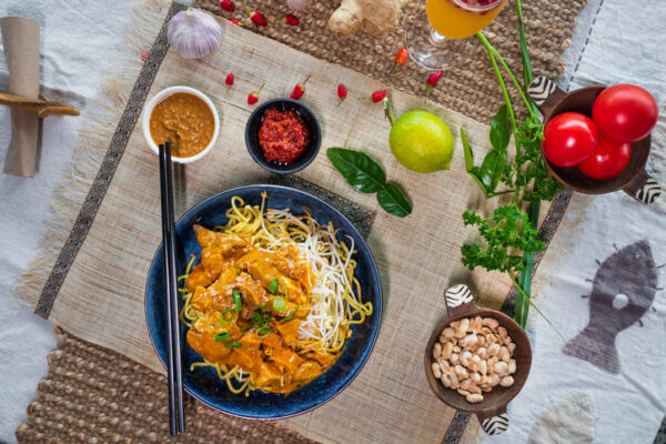 Asian food steams on a table