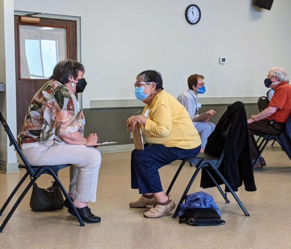 Two older adults having a conversation at Greenwood Senior Center's Speed Friending event
