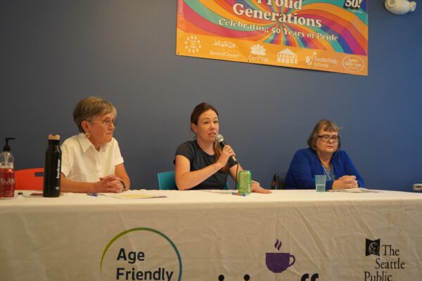 Speakers at August's Civic Coffee sit at a panel table.